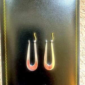 Sterling silver dangle earrings with 14k yellow gold posts.